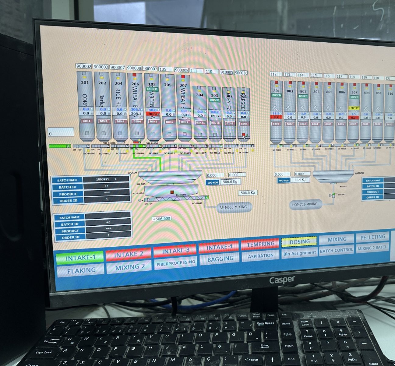 Feed mill batching SCADA with bin status, batch IDs and dosing weights